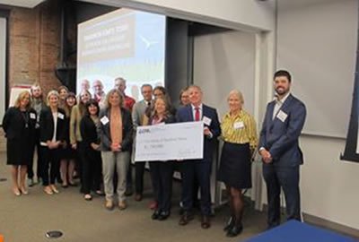 Recipients of a SNEP grant accepting a check