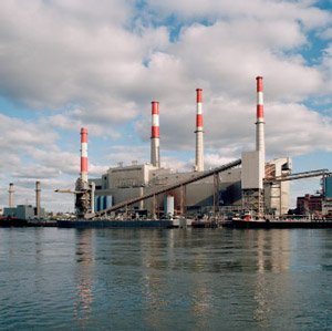 power plant image with red and white striped stacks