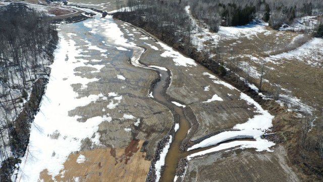 Ice begins to melt in the restored Unnamed Creek corridor. 