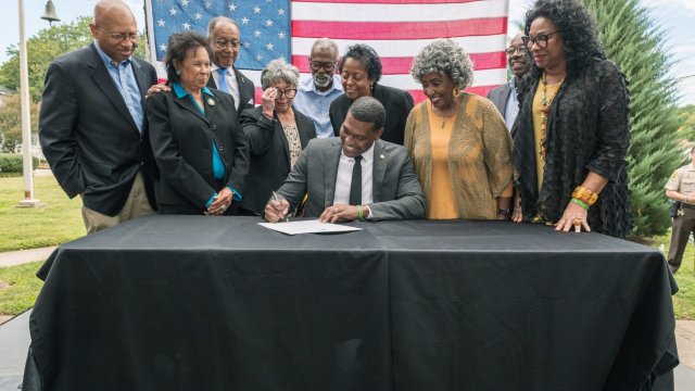 EPA Administrator Michael S. Regan signs document officially creating the new Office of Environmental Justice and External Civil Rights.