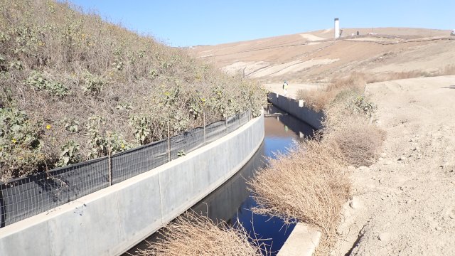 Leachate filling drainage channel upstream of the check dam on November 8, 2023