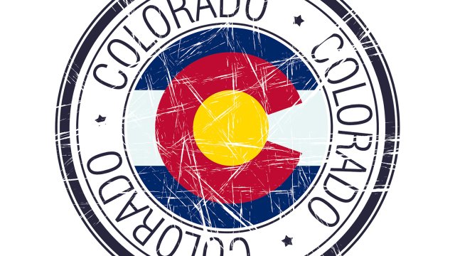 round stamp of the Colorado state flag