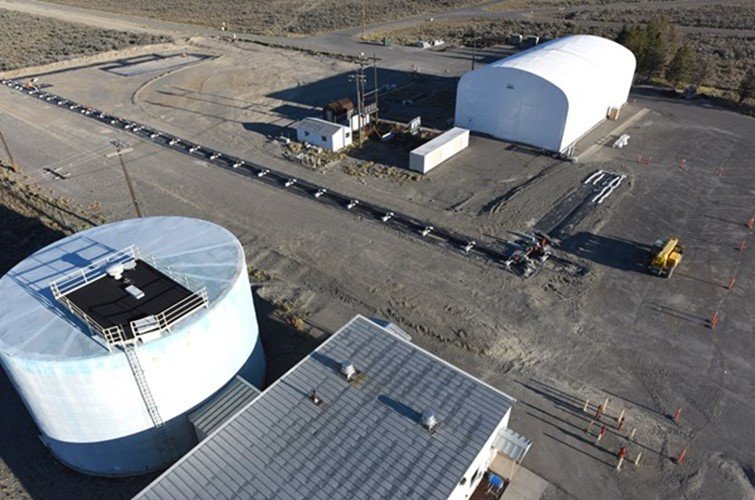 Aerial view of the Water Security Test Bed Facility, with a large pipe loop structure.