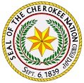 This is an image of a star encircled by two twigs with green leaves on them with the words Seal of the Cherokee Nation Sept 6, 1839 around it 
