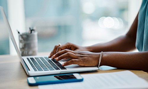 Listserv- photo of person typing on a keyboard