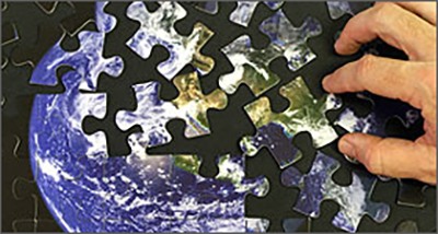 putting together a puzzle of the earth