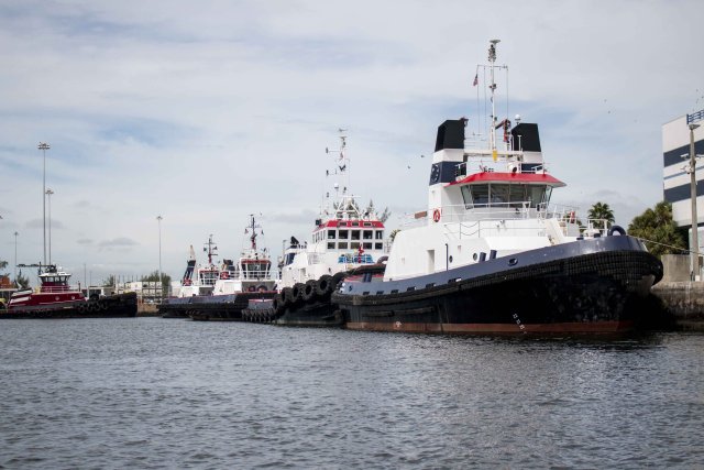 This is a picture of tug boats at a port