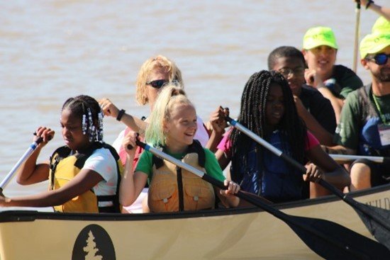 Children and adults enjoy paddling a canoe on the Maumee River in Toledo