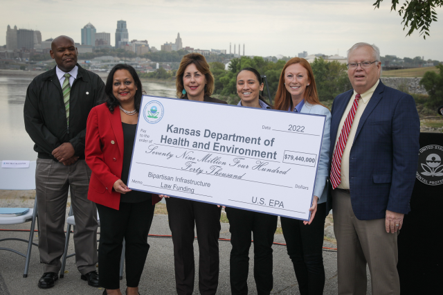 EPA Assistant Administrator for the Office of Water Radhika Fox, EPA Region 7 Administrator Meg McCollister, and U.S. Representative Sharice Davids (KS-3) present an $80 million “big check” in Bipartisan Infrastructure Law water funding to Kansas Department of Health and Environment Secretary Janet Stanek and KDHE Deputy Secretary for Environment Leo Henning at an event at Kaw Point Park in Kansas City, Kansas, Oct. 5.