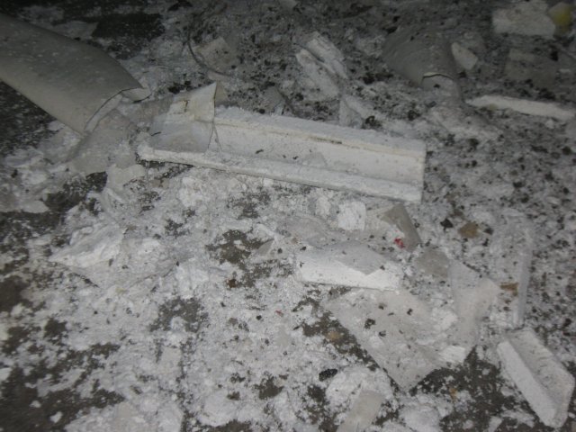 Asbestos containing demolition debri on ground