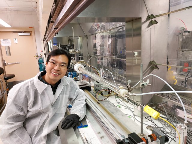 EPA researcher Yong Ho Kim conducts studies on air pollutants emitted from open burn pits and wildfires using the combustion system to generate smoke from various vegetation and synthetic materials.