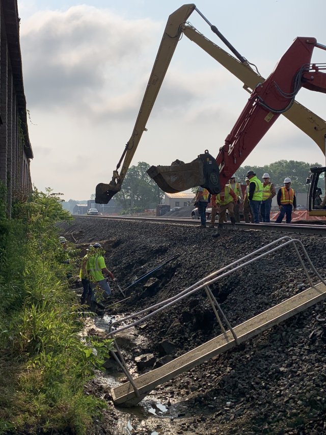 Workers in the north ditch alongside the tracks