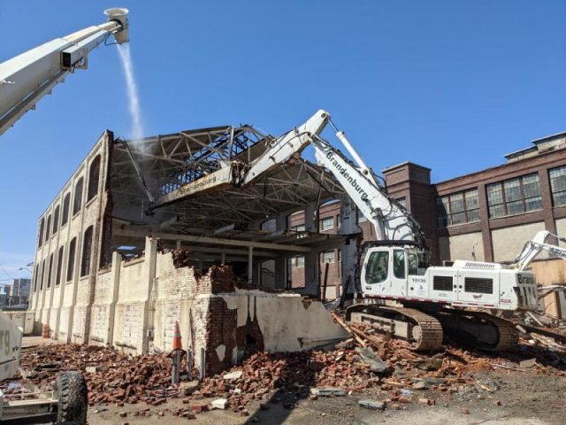 A picture containing demolition activities by EPA contractors.