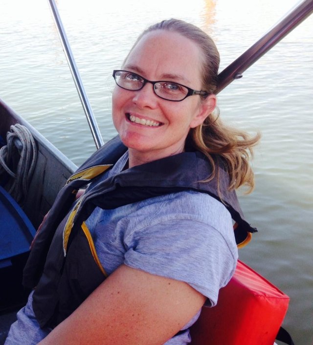 cindy fields on a boat doing Participatory Science on the water