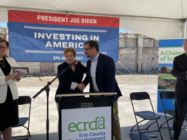 EPA Mid-Atlantic Regional Administrator Adam Ortiz at a podium with Tina Mengine, President of the Erie County Redevelopment Authority.