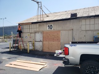Boarding up being done at the Electrician Shop, an ancillary (support) building.