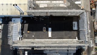 Aerial view of Full Enclosure Unit roof removal.
