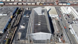 Aerial view of Full Enclosure Unit being disassembled. The fabric roof has been removed.