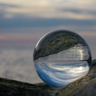 Small globe with reflection of body of water