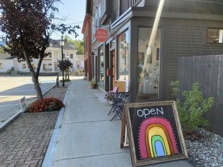 a downtown street with an open art gallery