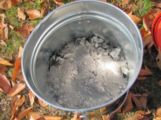 wood ash in metal pail