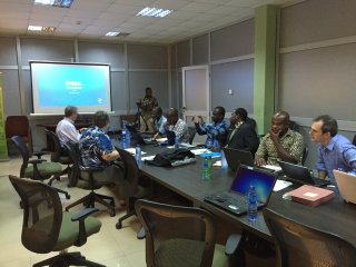 Meeting between EPA, Ghana government officials, and others to address local air pollution.
