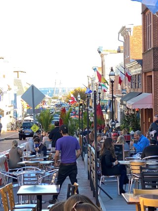 Outdoor dining is set up on the streets of downtown Annapolis on a beautiful day