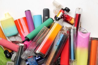 This is a photo of a pile of colorful vape pens