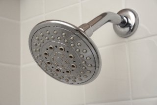 a picture of a showerhead in a stall