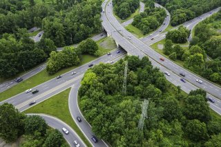 Aerial view of highway system with vegetation
