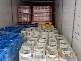 Pallets of different types of HFCs in containers, examined by EPA inspectors at a port.